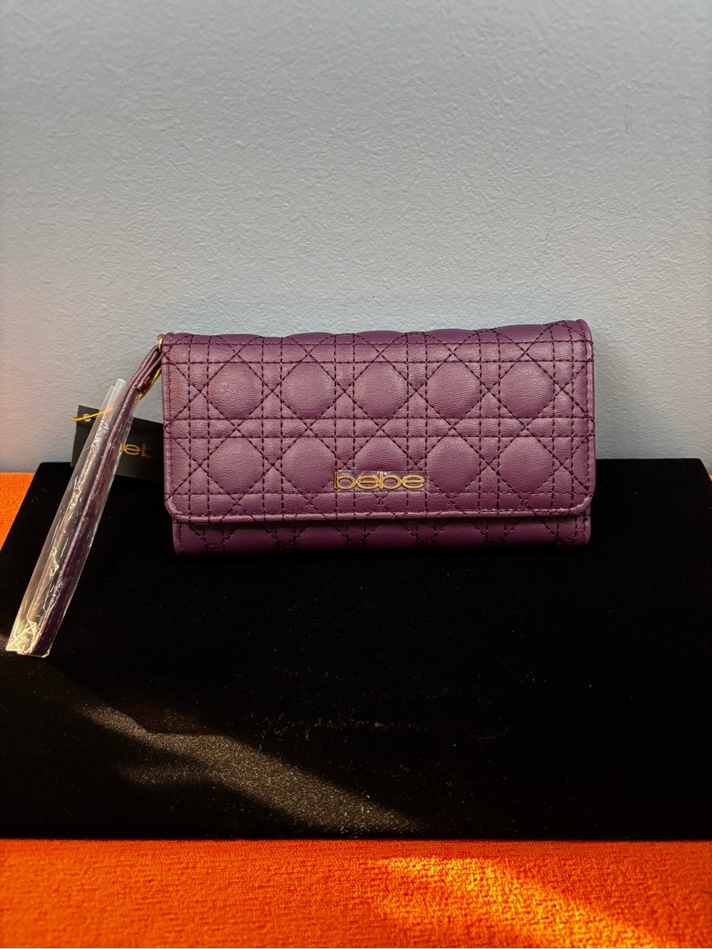 bebe Quilted Plum Wristlet Wallet with Gold Logo